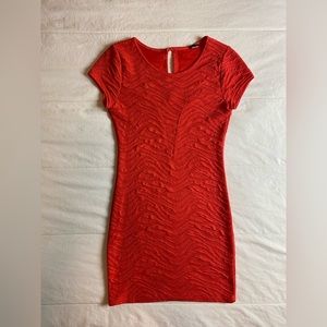 Bright orange tight dress